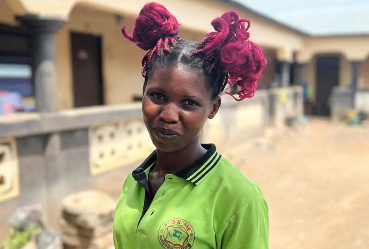Girl smiles to the camera